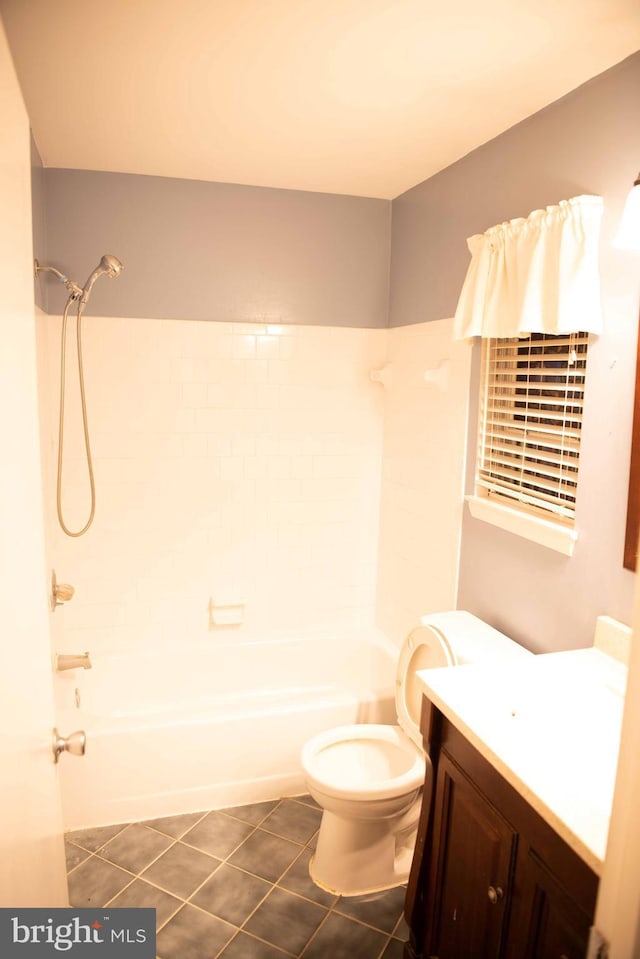 full bathroom with shower / tub combination, tile patterned flooring, vanity, and toilet