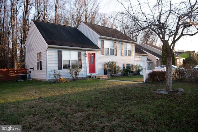 tri-level home with a front yard