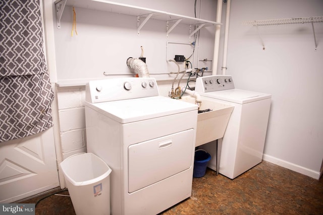 clothes washing area featuring washer and dryer