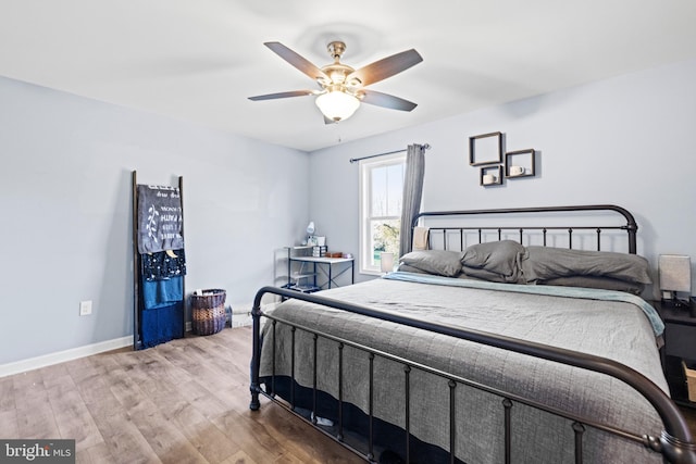 bedroom featuring ceiling fan and light hardwood / wood-style floors