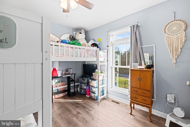 bedroom with hardwood / wood-style floors and ceiling fan