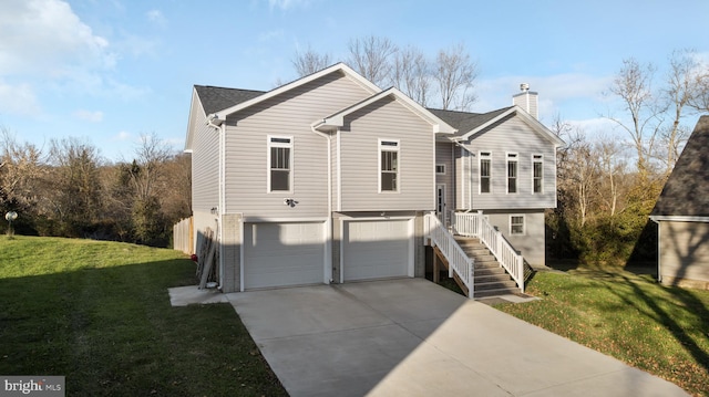 view of front of house featuring a garage and a front yard