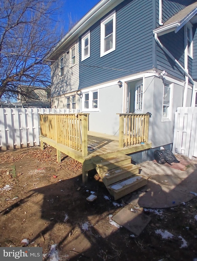 rear view of house featuring a deck