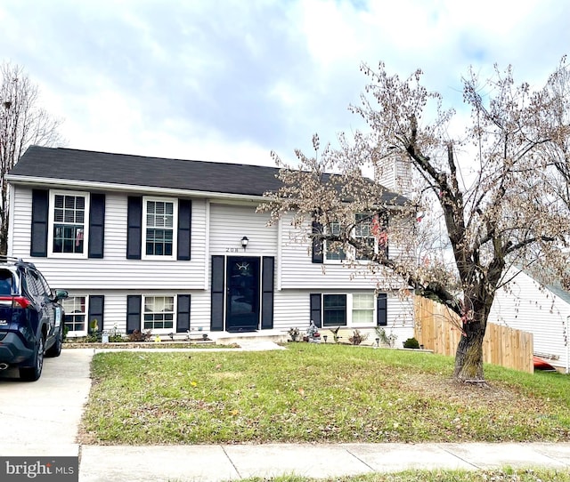 raised ranch with a front lawn