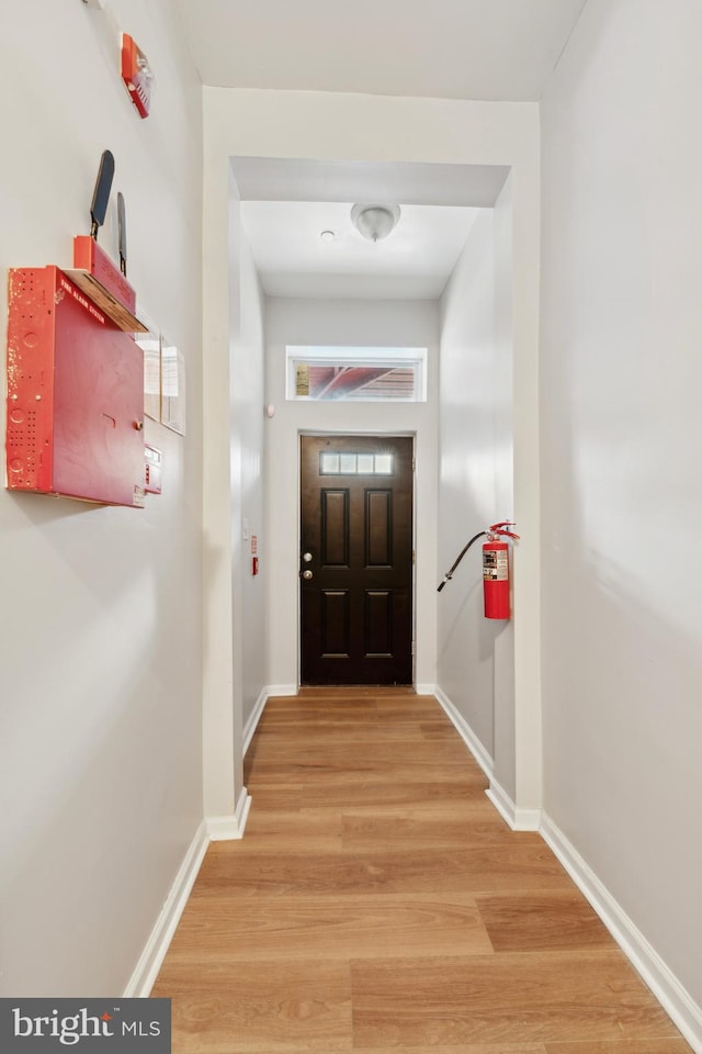 doorway with hardwood / wood-style floors