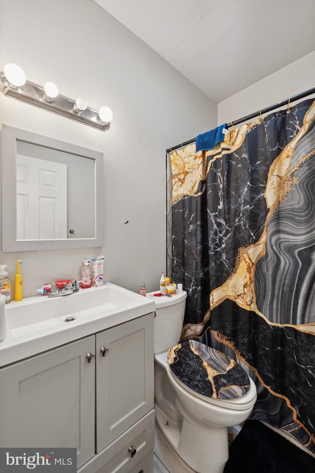 bathroom with vanity and toilet