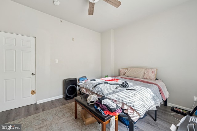 bedroom featuring ceiling fan and wood-type flooring