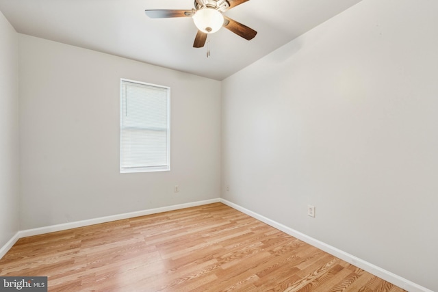 empty room with ceiling fan and light hardwood / wood-style floors