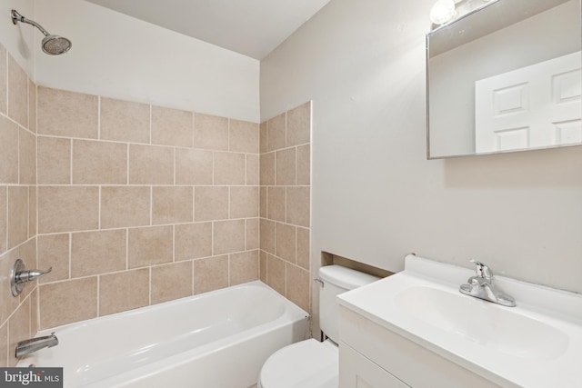 full bathroom featuring vanity, tiled shower / bath combo, and toilet