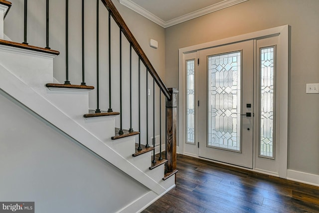 foyer entrance featuring dark hardwood / wood-style flooring and ornamental molding