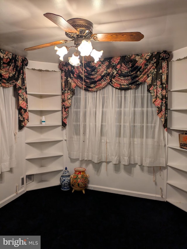 unfurnished dining area with ceiling fan and carpet floors