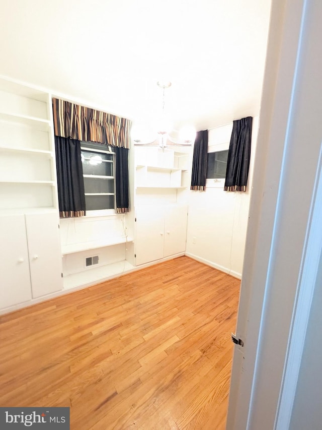 unfurnished room featuring light wood-type flooring