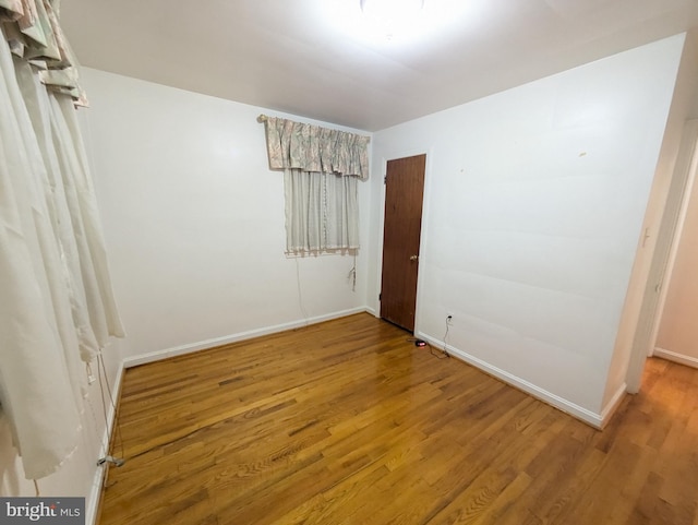 unfurnished bedroom featuring hardwood / wood-style floors