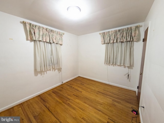 unfurnished room featuring wood-type flooring