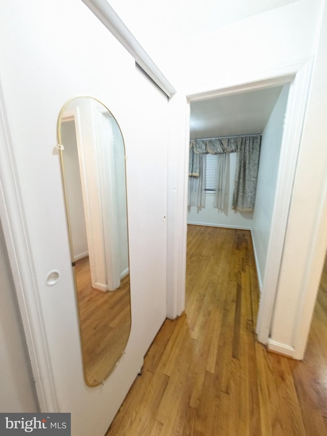 hallway featuring light hardwood / wood-style flooring