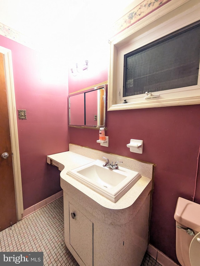 bathroom with vanity and toilet