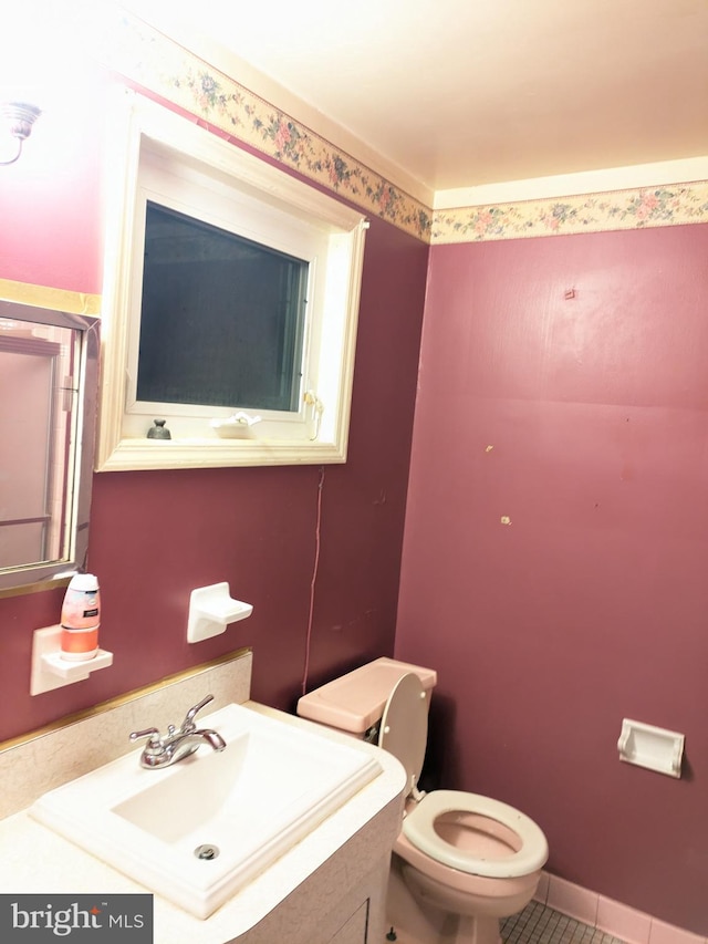 bathroom with tile patterned floors, sink, and toilet