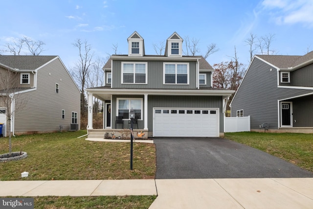 view of front facade featuring a garage and a front lawn