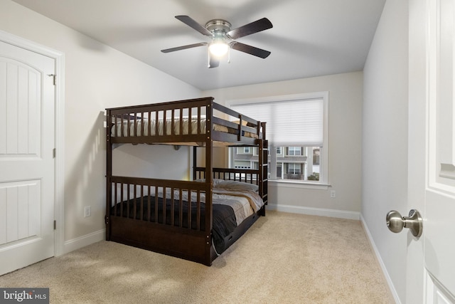 bedroom featuring light carpet and ceiling fan