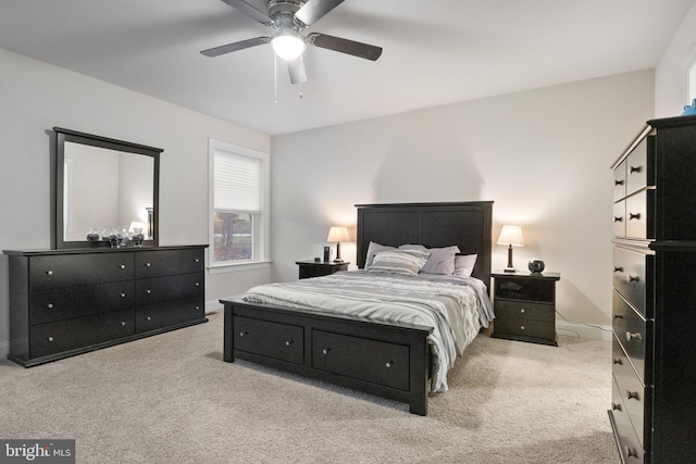 bedroom featuring light carpet and ceiling fan