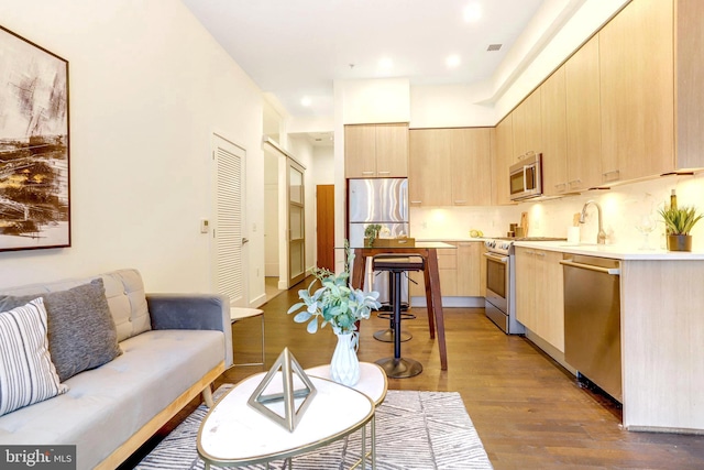 living room with dark hardwood / wood-style floors