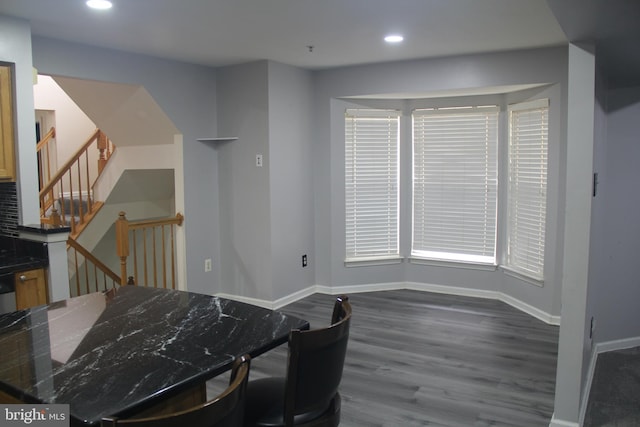 dining area featuring dark hardwood / wood-style flooring