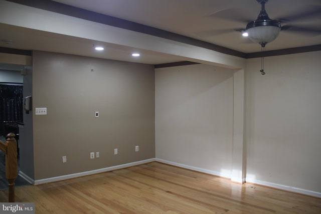 empty room with ceiling fan and light wood-type flooring