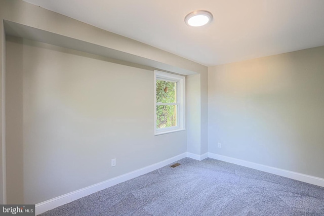 spare room featuring carpet flooring