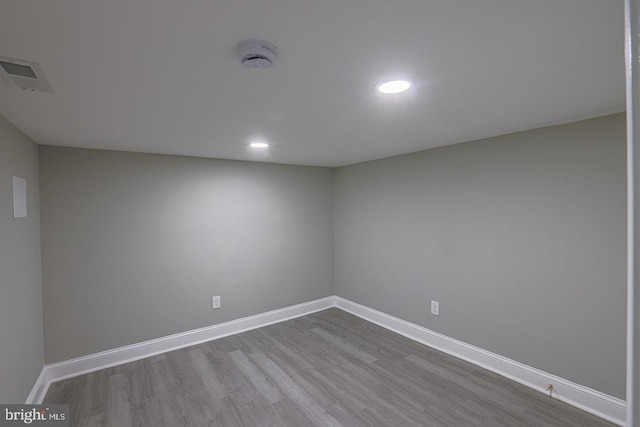 unfurnished room with light wood-type flooring