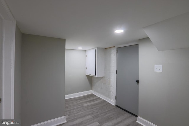 basement featuring light wood-type flooring