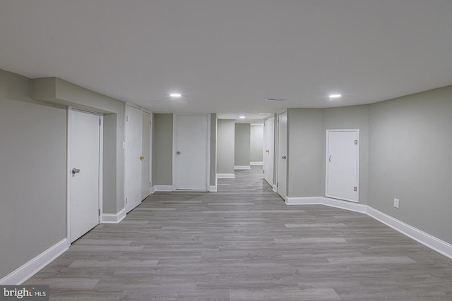 basement featuring light hardwood / wood-style floors