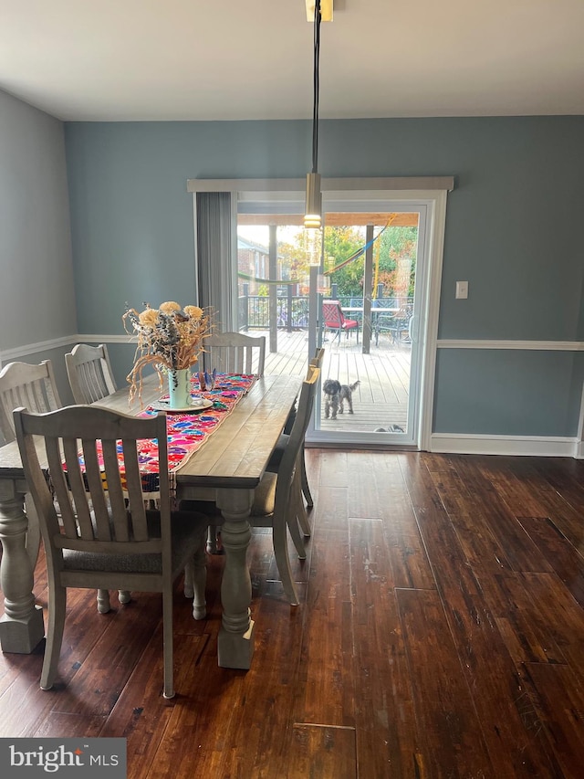 dining room featuring dark hardwood / wood-style flooring