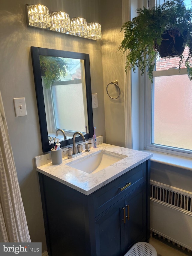 bathroom with vanity and radiator