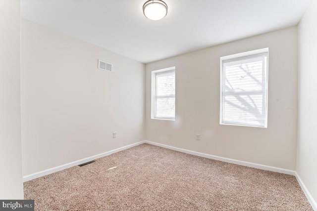 spare room with carpet floors