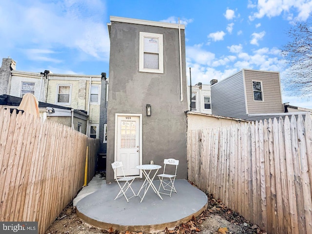 rear view of house featuring a patio area