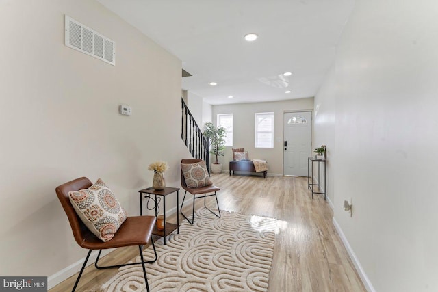 foyer with light hardwood / wood-style floors