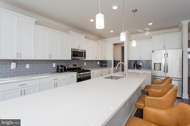 kitchen featuring appliances with stainless steel finishes, sink, and white cabinets