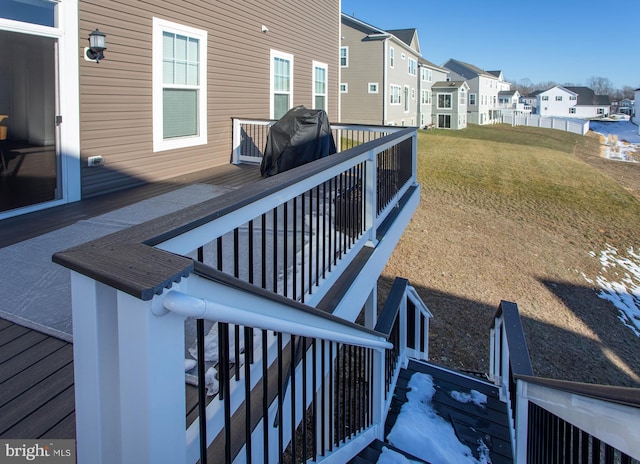 wooden deck with a yard