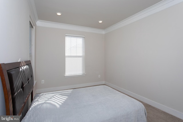 carpeted bedroom featuring crown molding