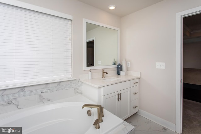 bathroom with vanity and a washtub