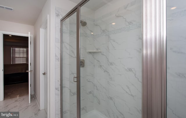 bathroom with a shower with shower door