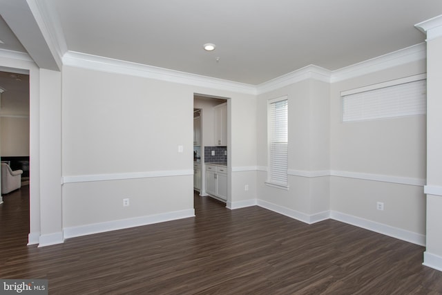 unfurnished room with crown molding and dark wood-type flooring