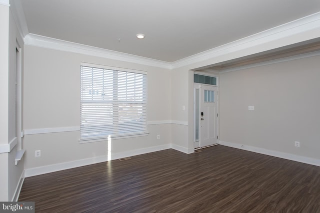 unfurnished room featuring crown molding and dark hardwood / wood-style flooring