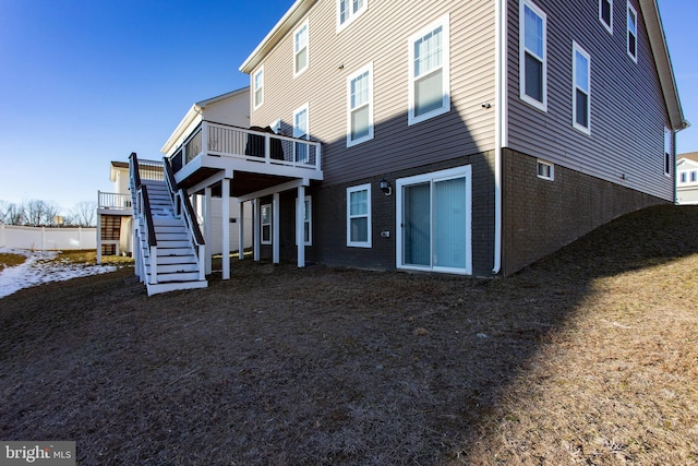 back of property featuring a deck