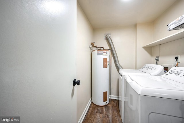 laundry area featuring dark hardwood / wood-style flooring, electric water heater, and washer and clothes dryer