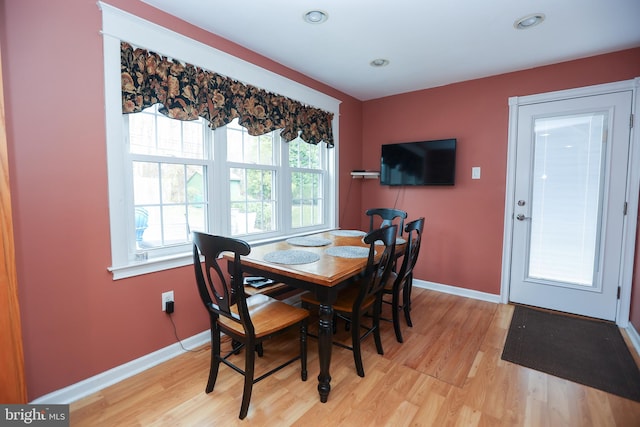 dining area with light wood-type flooring