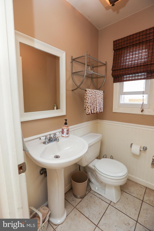 bathroom with tile patterned floors and toilet