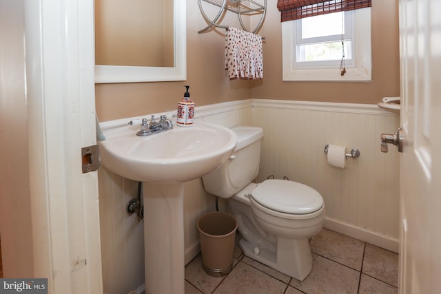 bathroom featuring toilet and tile patterned floors