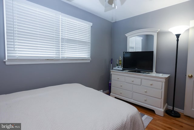 bedroom featuring ceiling fan and light wood-type flooring