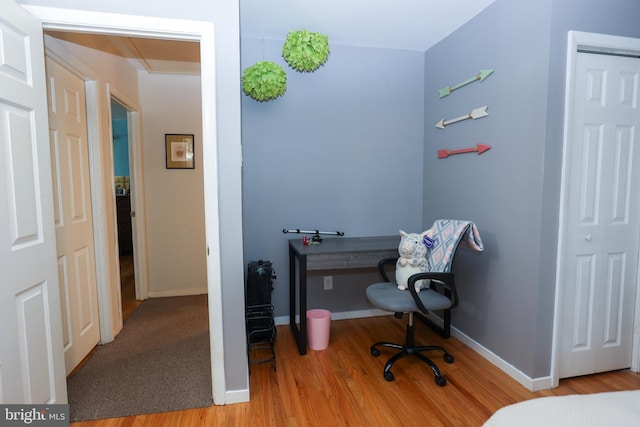 office with light wood-type flooring